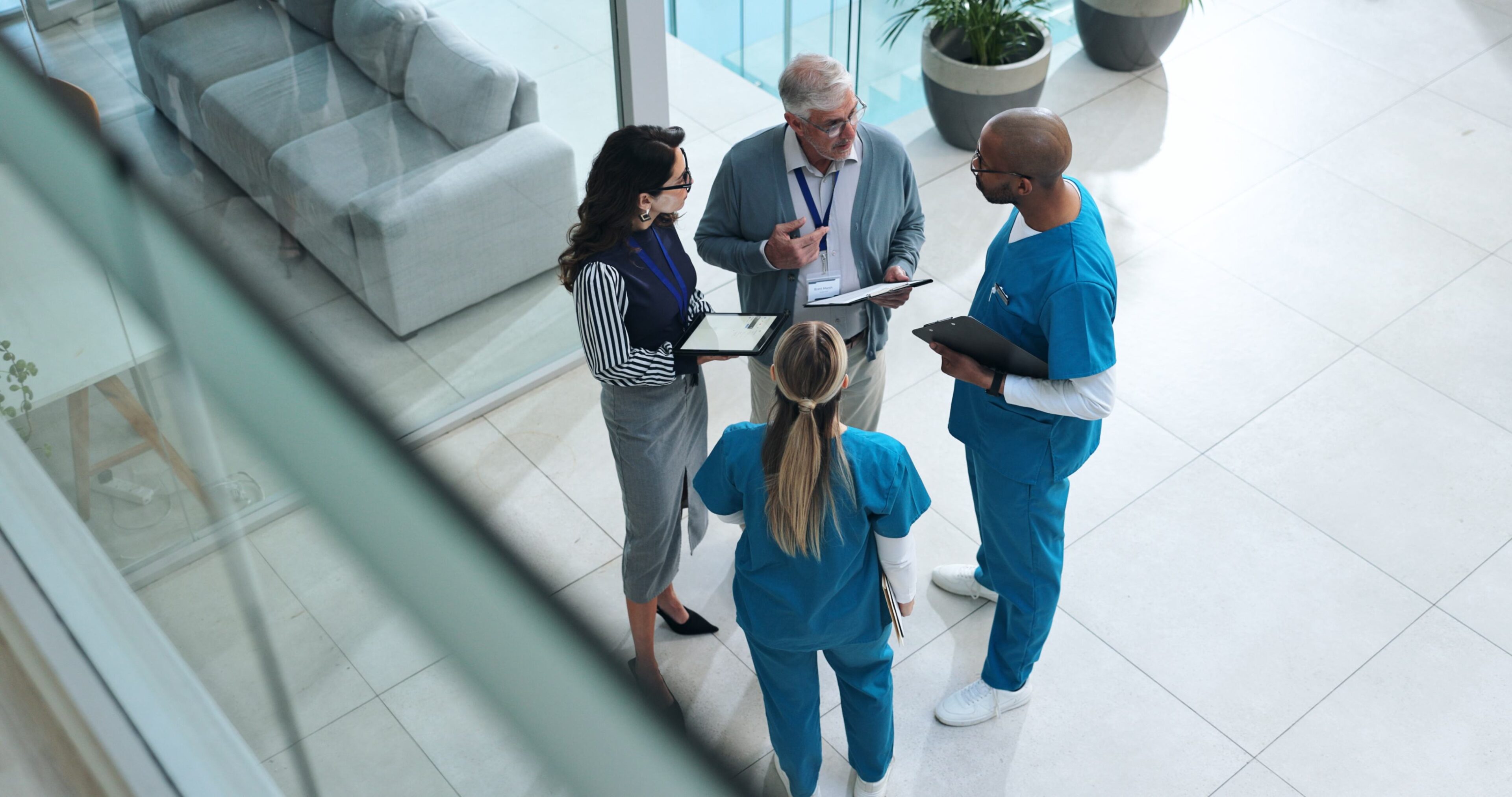 Medical team meeting, discussing patient files.